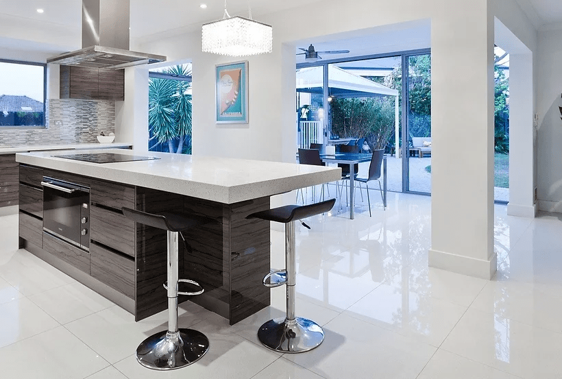 Modern kitchen featuring stylish flooring, highlighting its impact on quality and feel.