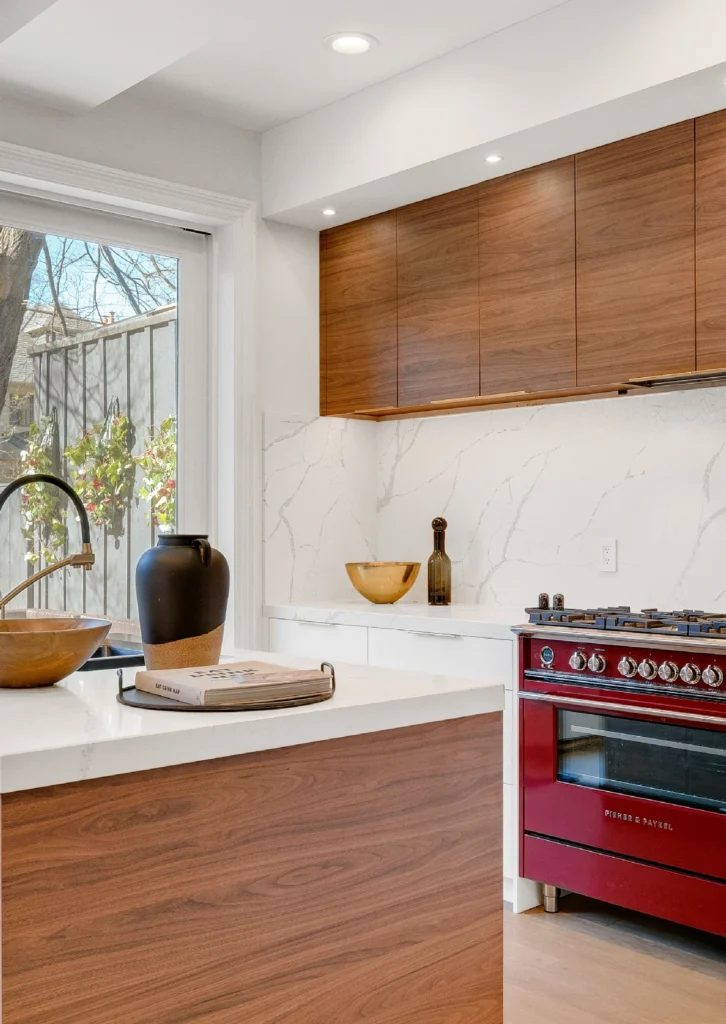 Kitchen showcasing both second-hand granite and elegant Carrara marble worktop options.