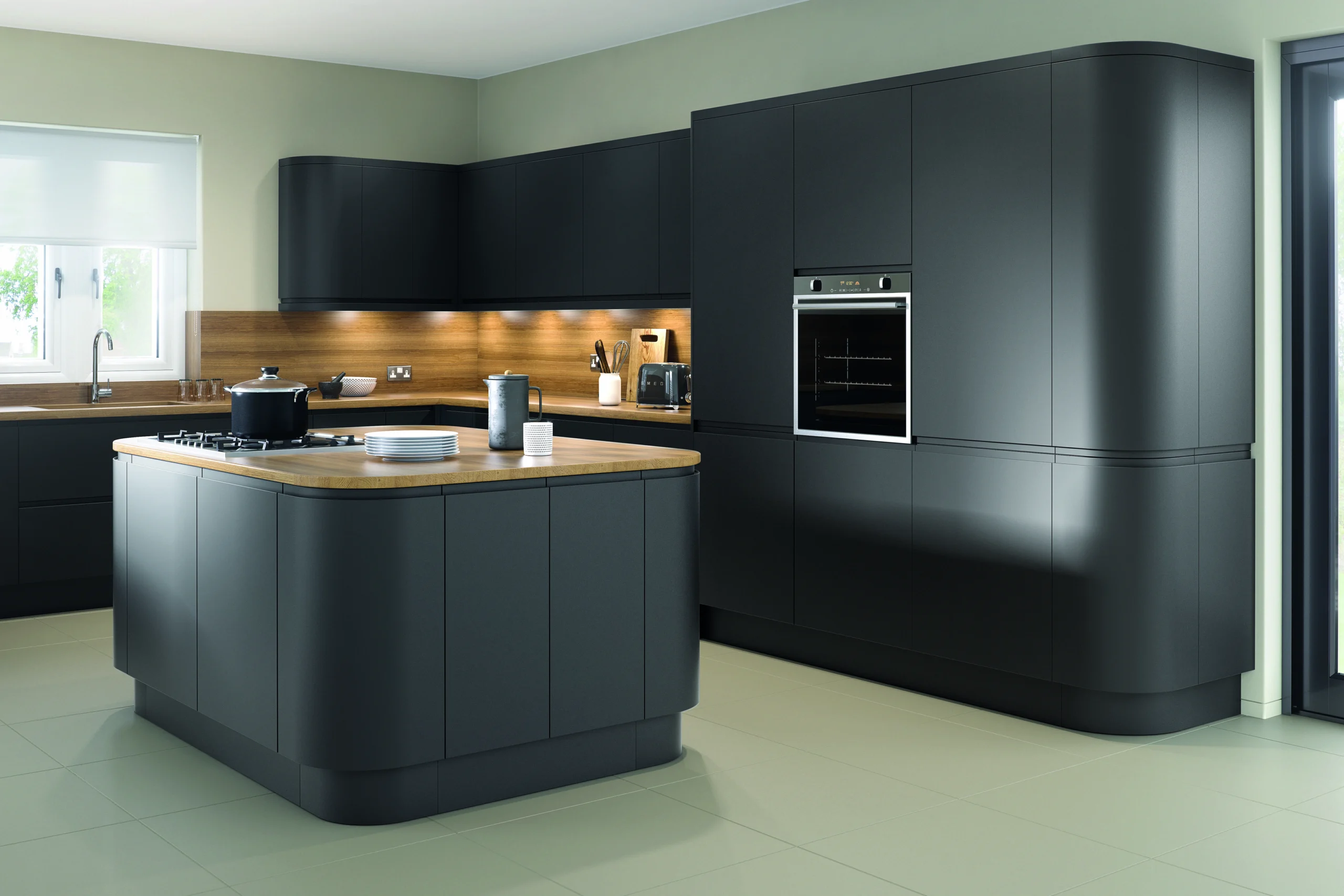 Modern kitchen showcasing seamless integration of black appliances with cabinetry, countertop, and flooring, creating a cohesive and stylish design.
