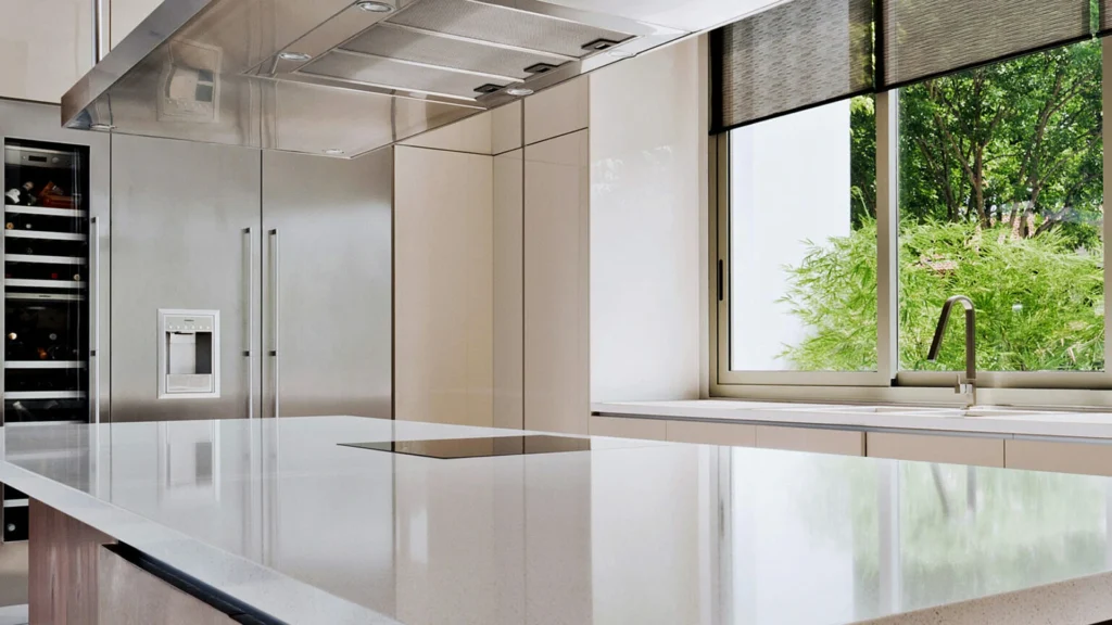 The white kitchen with Caesarstone snow quartz worktops has a sleek design with plenty of storage in the cabinets.